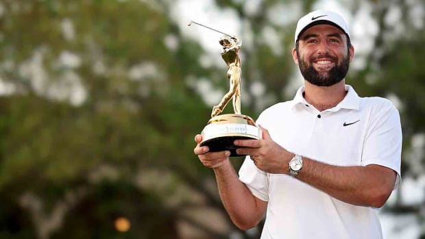 Scottie Scheffler poses with the trophy after winning the 2024 Players Championship at TPC Sawgrass in Ponte Vedra Beach, Fla.